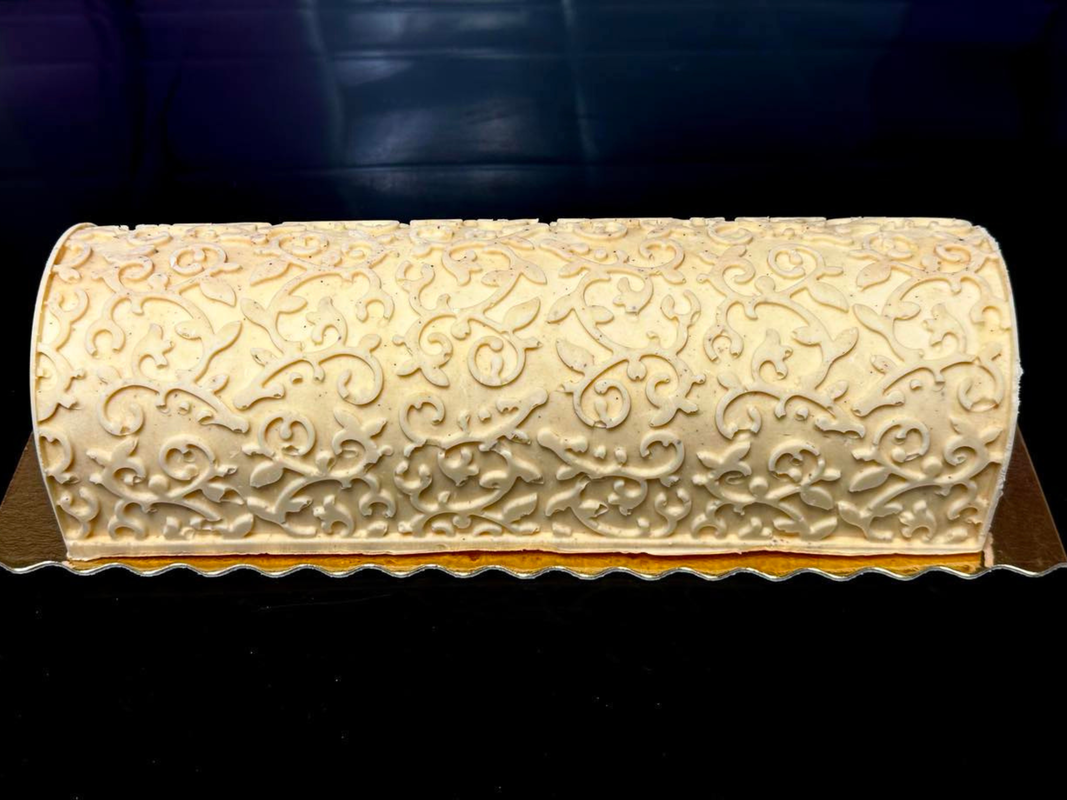 An Arabesque ice cream cake finished with an intricate suede pattern.