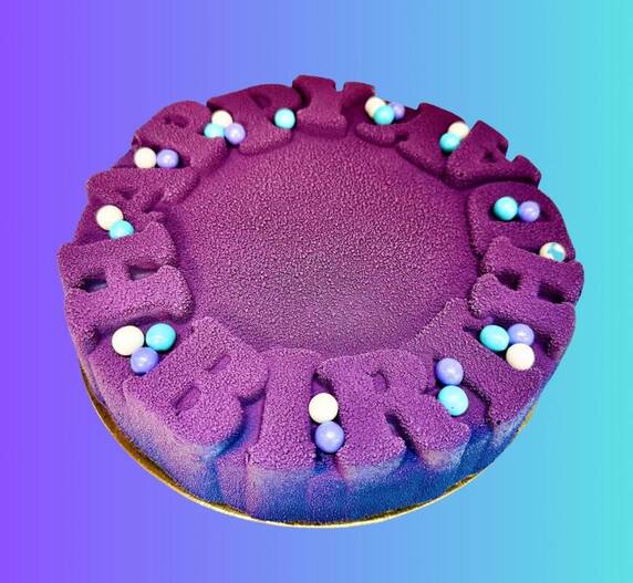 A 3-D Happy Birthday cake with raised two-tone lettering.