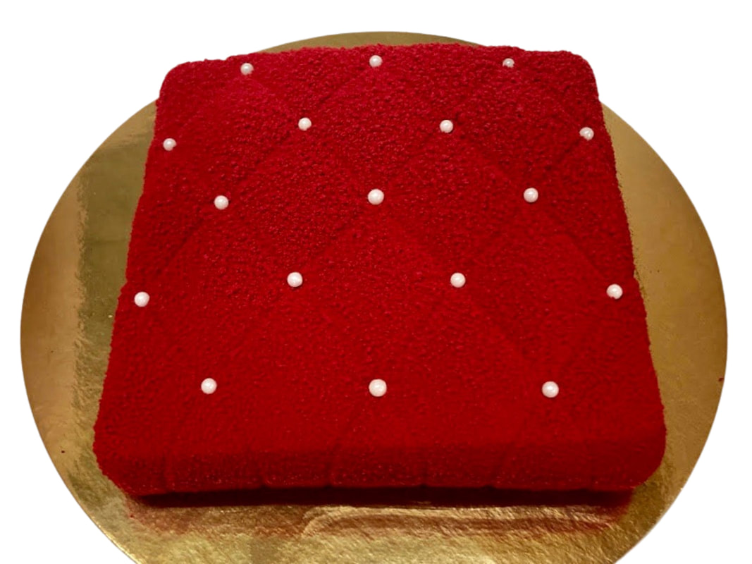 The Princess Pillow cake, a tufted pillow shape with pearl accents.