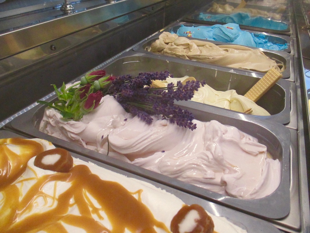 Pale purple lavender and honey gelato smoothed in its tray.